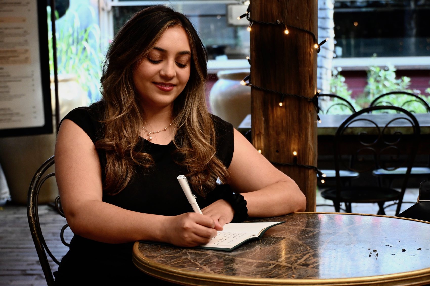 Angelique writing in her journal